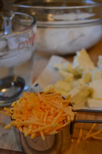 Grated cheddar cheese for crust
